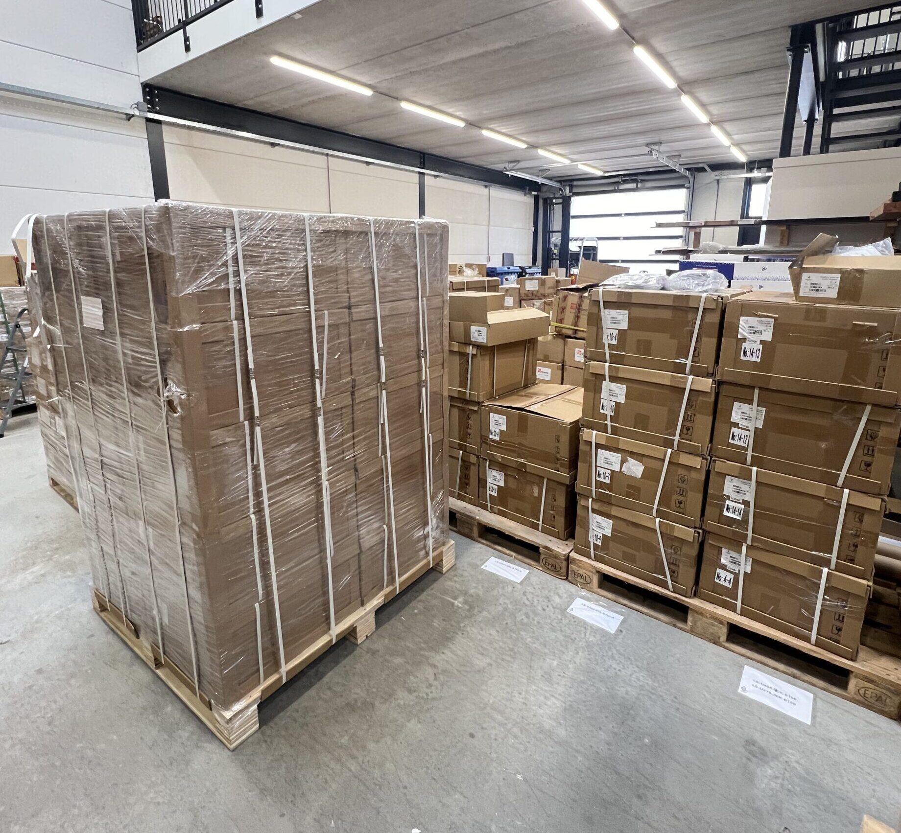 office moving Professional Moving Company 2 Goods on pallets wrapped and prepared for a warehouse relocation